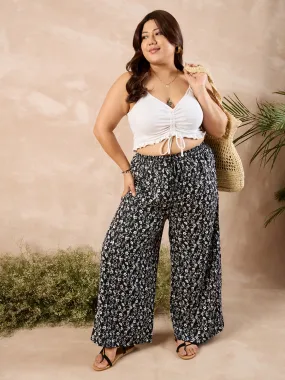 Berrylush Curve Women Black & White Floral Printed High-Rise Elastic Waist Relaxed-Fit Tie-Up Wide-Leg Trousers